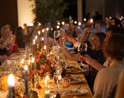 group dining at a table at a large event