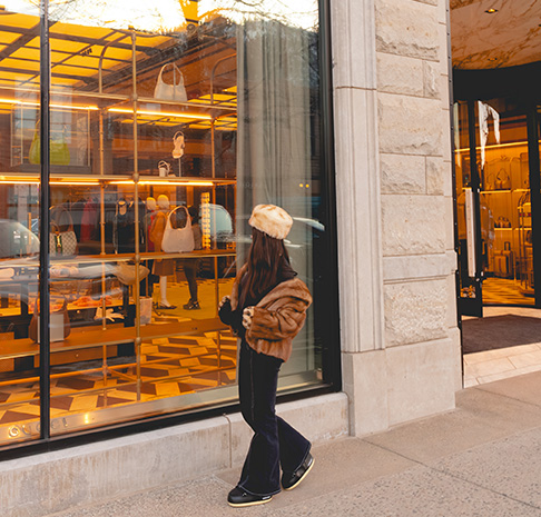 woman window shopping downtown aspen