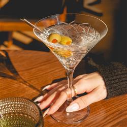 martini in womens hand