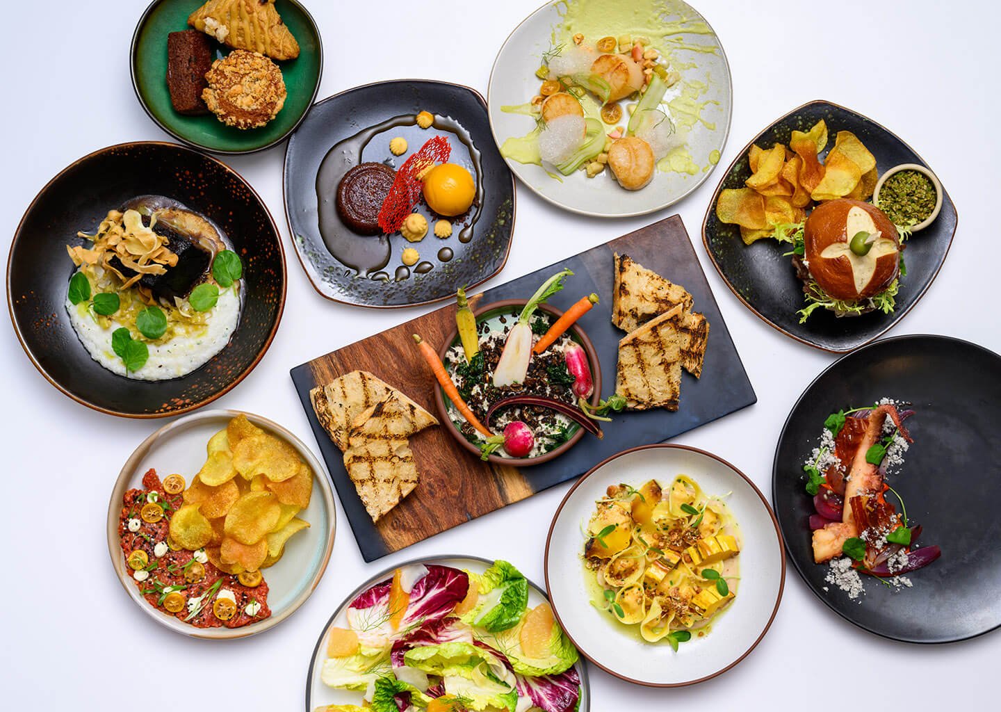 Spread of various appetizers and main dishes